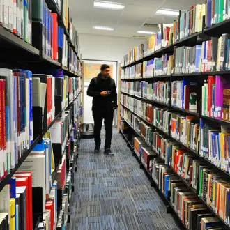 student walking in Ƶ Library